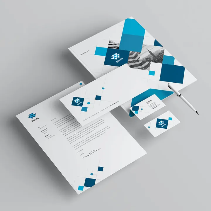 Letterhead, envelope and business cards with a blue diamond pattern